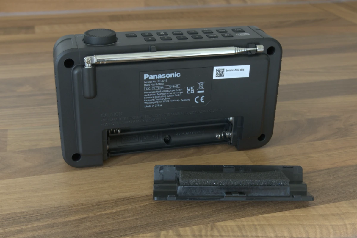 The slot for four AA batteries is on the rear of the radio